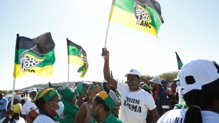 Supporters of former South African President Jacob Zuma, who was sentenced to a 15-month imprisonment by the Constitutional Court, sing and dance in front of his home in Nkandla, South Africa, on July 3, 2021.